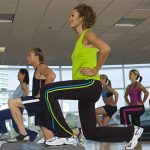 People Exercising in Step Aerobics Class